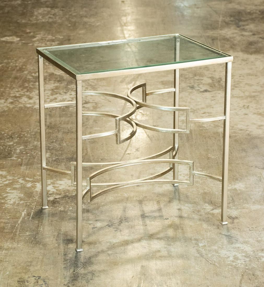 Modern Geometric Side Table: Modern geometric side table having various revolves on the base and glass beveled top. Unmarked