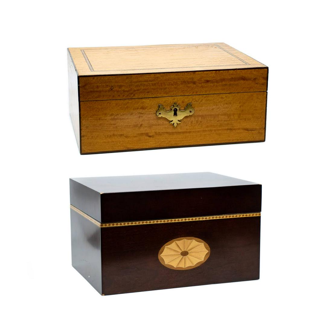 Group of 2 English Inlaid Wooden Boxes: A group of two wooden inlaid English boxes; first having satinwood veneer with inlaid border and bright blue felt liner with brass lock plate and key with tassel; second having dark mahogany with inla
