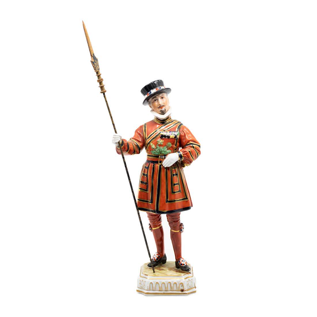 Dresden The Yeoman of the Guards Porcelain Soldier: A Dresden Carl Thieme 'The Yeoman of the Guards' porcelain soldier in hand-painted traditional clothing having wooden partisan in hand. Marked on the underside.