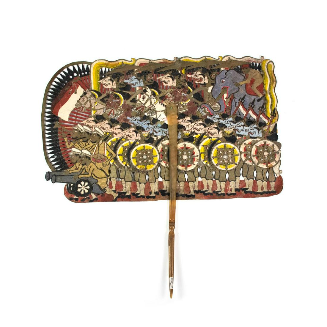 Indonesian Wayang Kulit Large Battle Shadow Puppet: A large scale Indonesian Wayang Kulit flat puppet intricately hand painted on leather hide depicting a battle scene with several male figures riding horses and elephants at the top, while men with shi