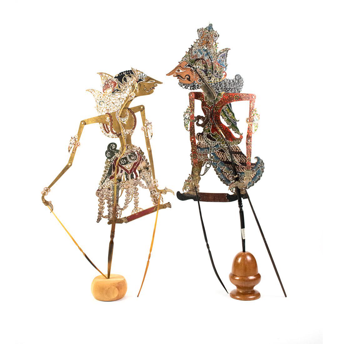 Set of Two Indonesian Wayang Kulit Puppets: A set of two Indonesian Wayang Kulit flat puppets (early 20th century) intricately hand painted on leather hide representing character Betara Barhma (right) and an unknown character on the left, both