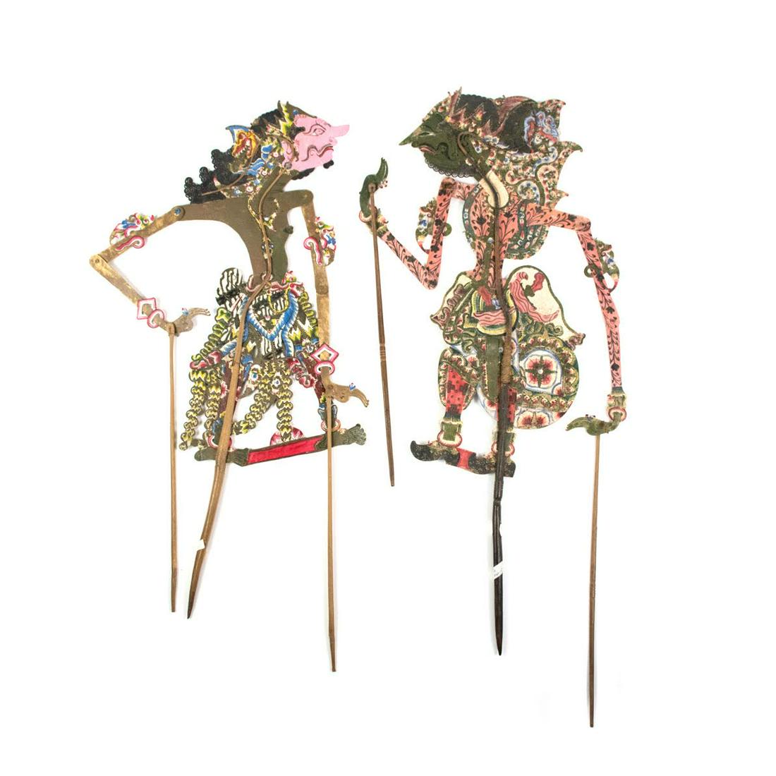 Two Indonesian Wayang Kulit Citraksa & Bisma Puppets: A set of two Indonesian Wayang Kulit flat puppets (c.1920) intricately hand painted on leather hide representing characters Citraksa (left) from Surakarta and Bisma (right) from Ceper. Each are suppor