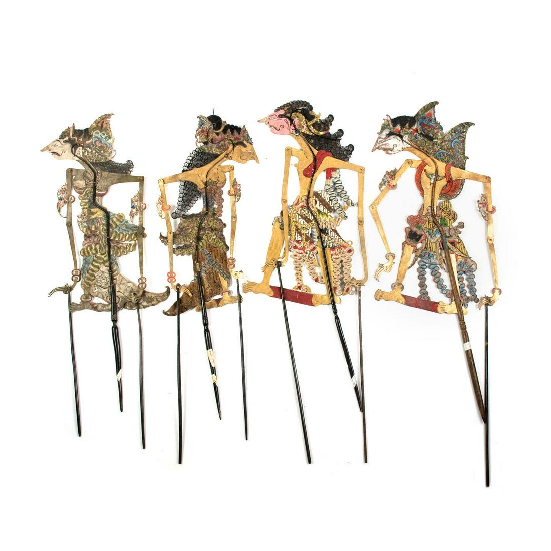 Group of Four Indonesian Wayang Kulit Shadow Puppets: A group of four Indonesian Wayang Kulit flat puppets intricately hand painted on leather hide representing characters Bamang Bremani (3rd) from Yogyakarta c.1920 and Dwasrani (4th) c.1900. The first t