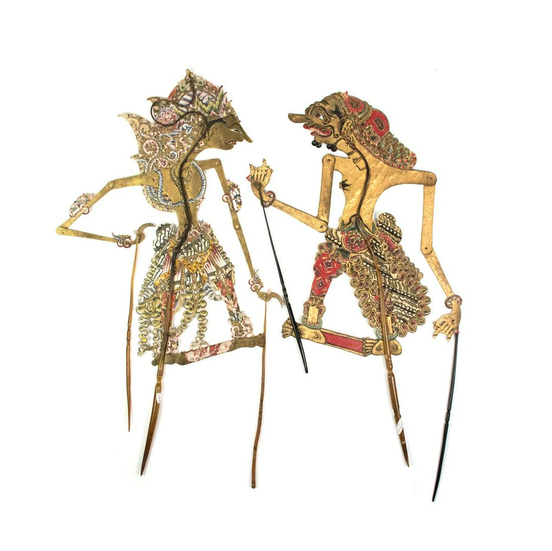 Two Indo Wayang Kulit Bonopati & Patih Sengkuni Puppets: A set of two Indonesian Wayang Kulit flat puppets (20th century) intricately hand painted on leather hide representing characters Bonopati (left) from Surakarta and Patih Sengkuni (right) from Yogyaka