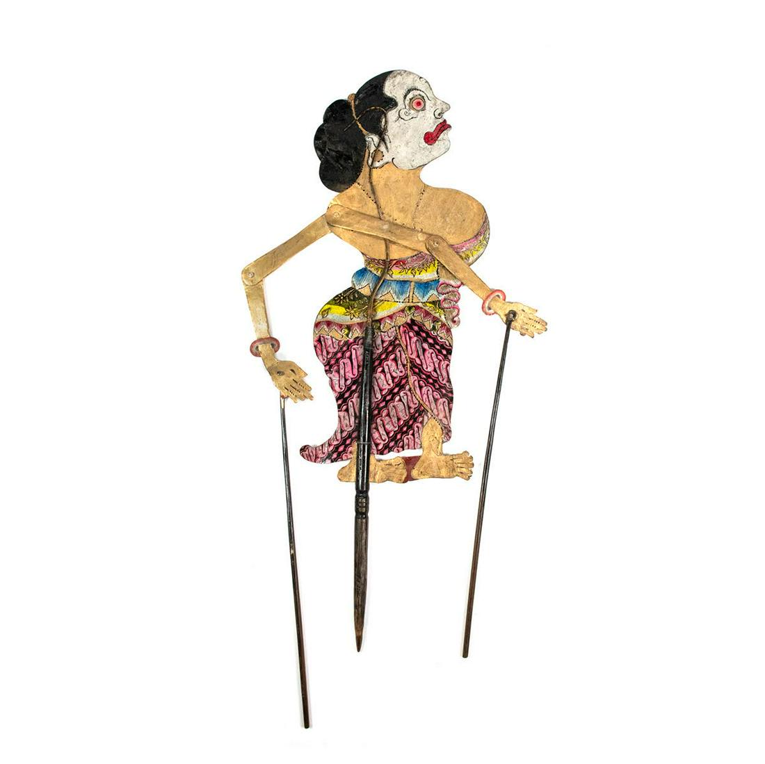 Indonesian Wayang Kulit Shadow Puppet of Limbuk: An Indonesian Wayang Kulit flat shadow puppet (1900) intricately hand painted on leather hide representing character Limbuk from the city Yogyakarta in the Central Java province. She is a funny servan