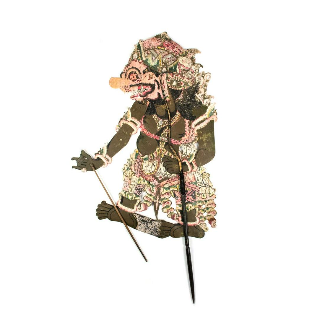 Indonesian Wayang Kulit Shadow Puppet: A large scale Indonesian Wayang Kulit flat puppet intricately hand painted on leather hide. The character in unidentified. The puppet is supported by horn rods on the body and appendages.