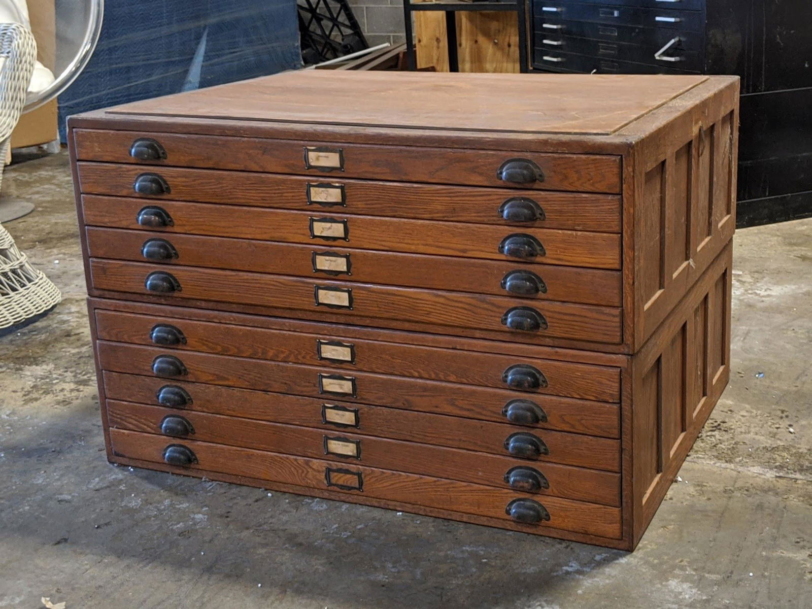 1930's Oak Flat Portfolio File Cabinet: A Two section stacked oak large portfolio flat file cabinet having two sections each with five drawers and each drawer having nameplates and two pull handles. Each section is 14.5" tall.