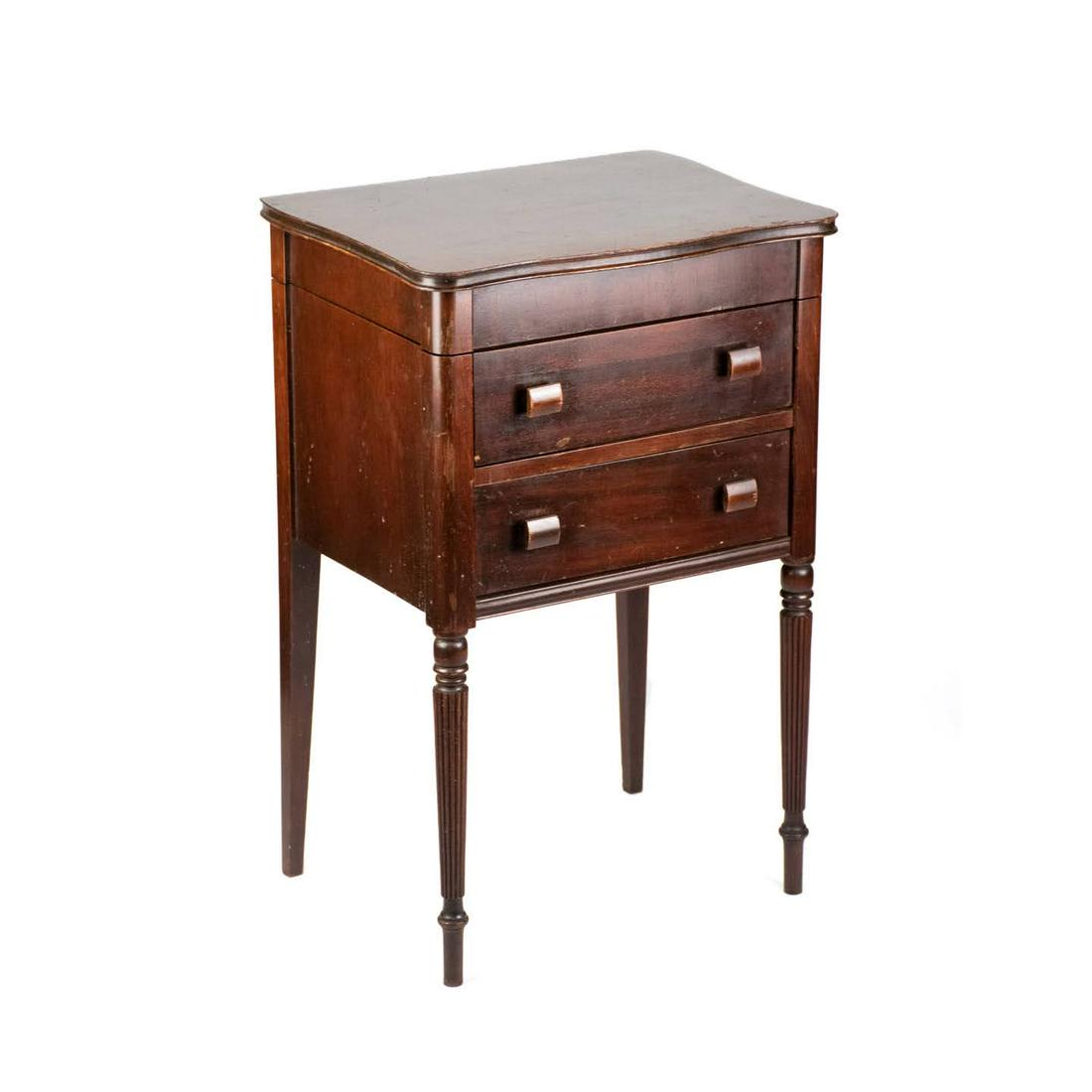 Vintage Caswell-Runyan Co. Walnut Perfect Sewing: A vintage Caswell-Runyan Co. 'Perfect Sewing Cabinet' constructed of walnut with opening top to reveal linen upholstered slots for storing spools of string and materials. Features two lower drawers wi