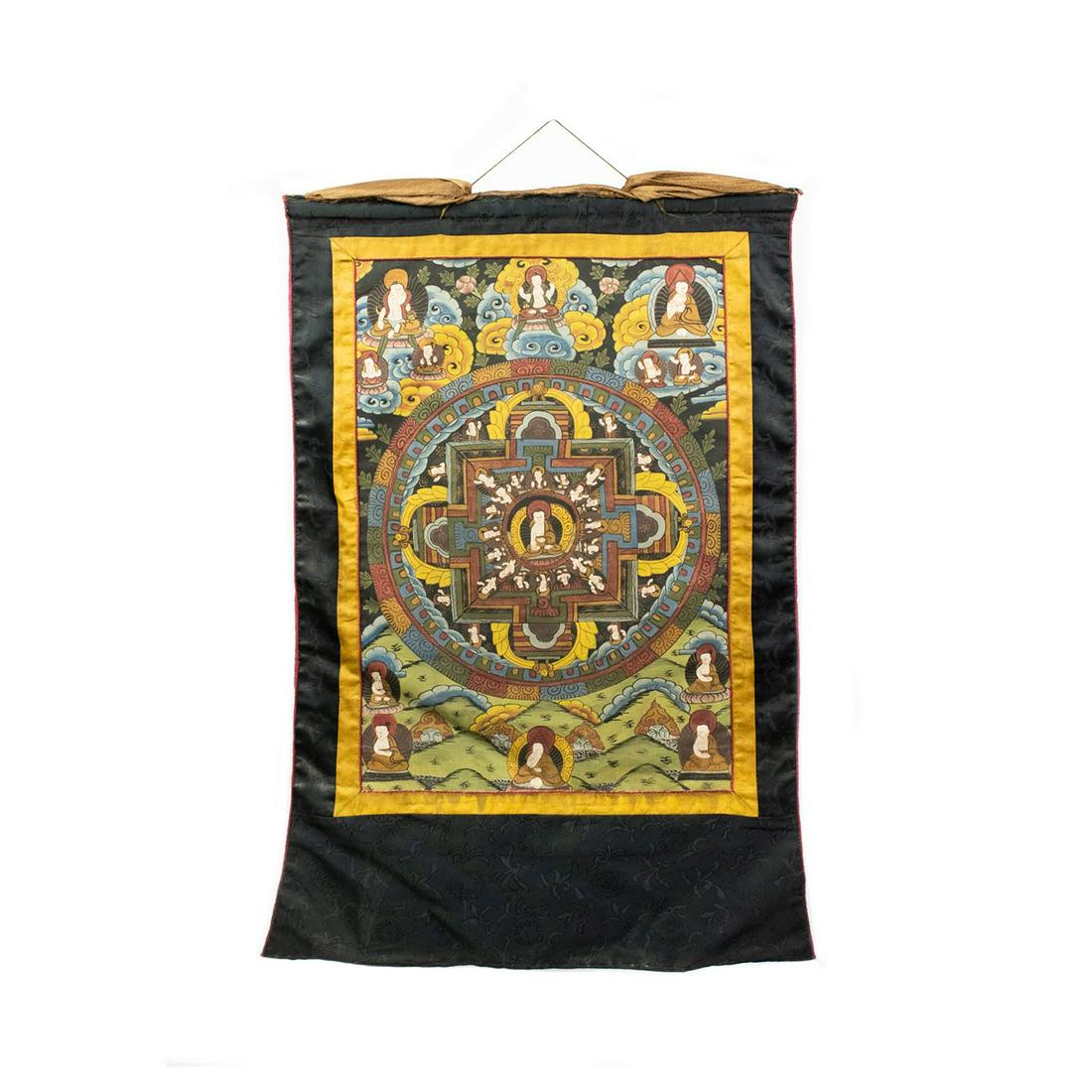 Early 19th C. Tibetan Figural Mandala Thangka: An early 19th century Tibetan figural Mandala Thangka having yellow, blue, green, red, and orange hand painted design including buddhist figures around geometric patterns. Constructed of applique pain