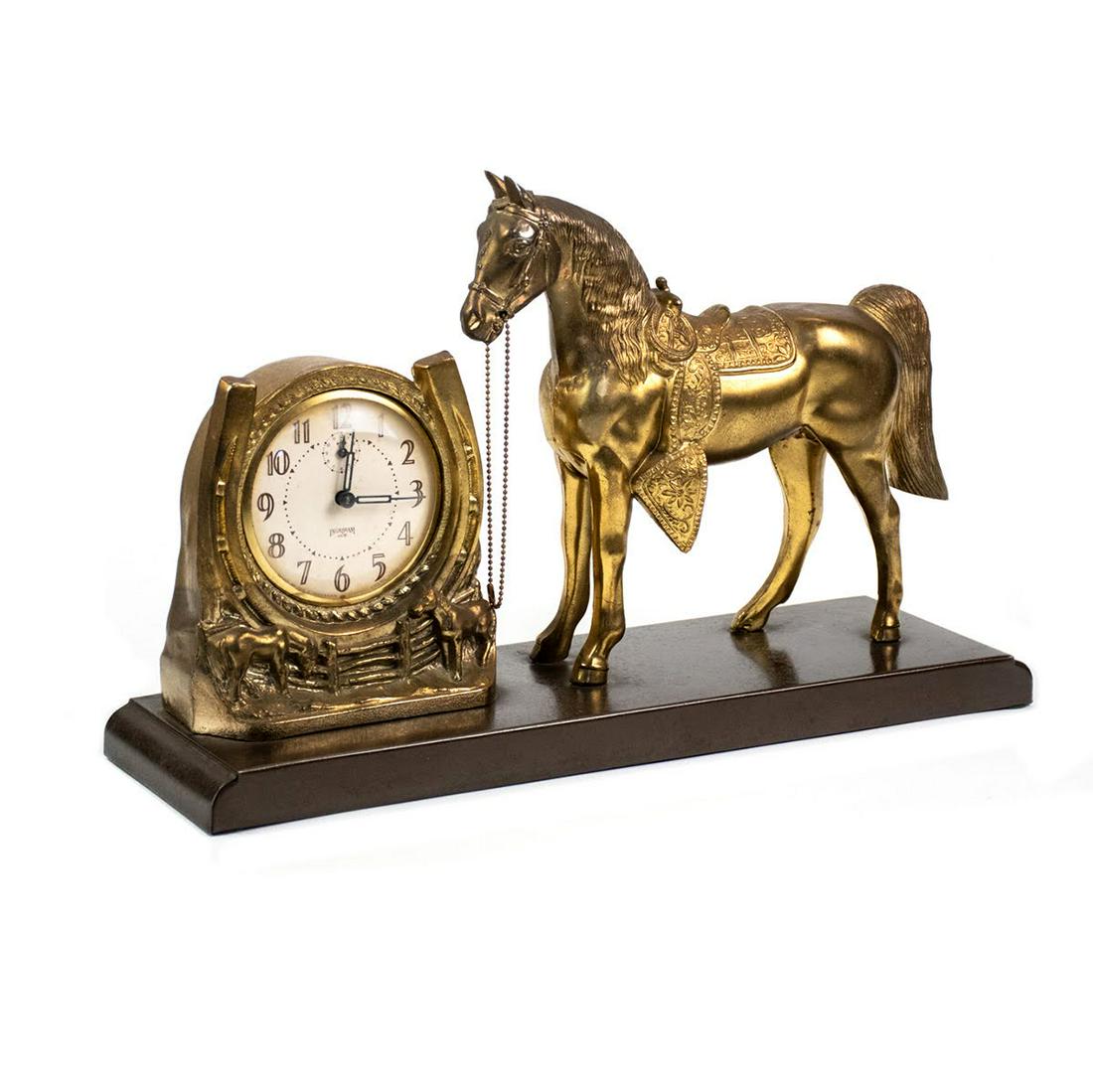 Ingraham Ace Co. Brass Western Mantel Clock: A vintage Ingraham Ace Co. brass Western style mantel clock with brass horse figure and brass clock having off-white face and black hands. Marked.