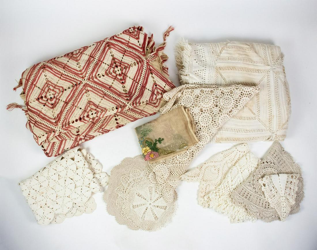 Group of 13 Blankets and Vintage Cloth Pieces: Grouping of 13 blankets and vintage cloth items including a red and white knit blanket, white knit blanket, embroidered Victorian wall hanging, and 10 white knit table runners and decorative doilies.