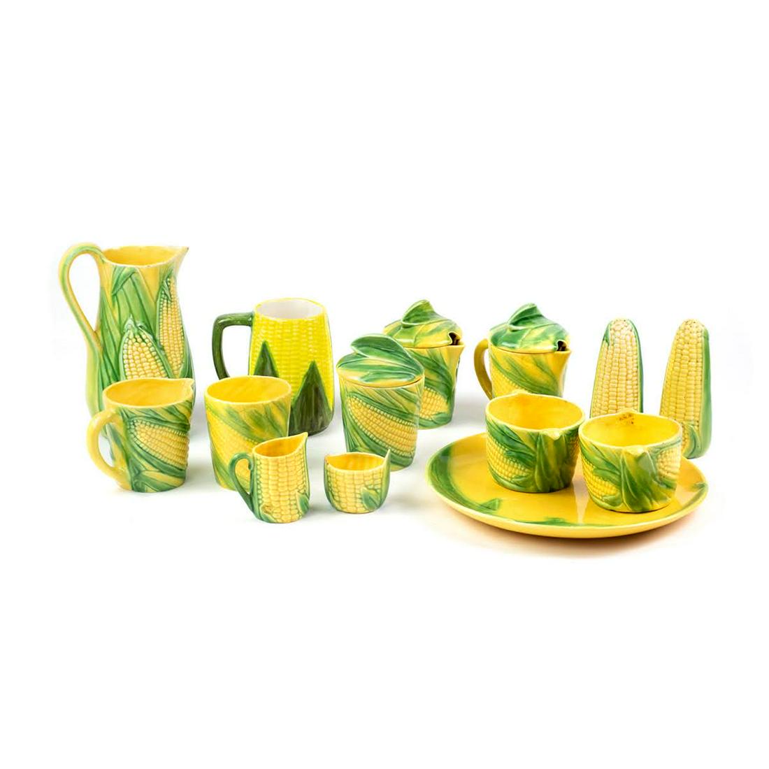 Vallona Starr California Corn Collection 14 Piece Set: A fourteen piece set of Vallona Starr California Corn Collection ceramic serveware including two lidded creamers, one pitcher, one unlidded creamer, one cup without handle, one mug, salt and pepper sh