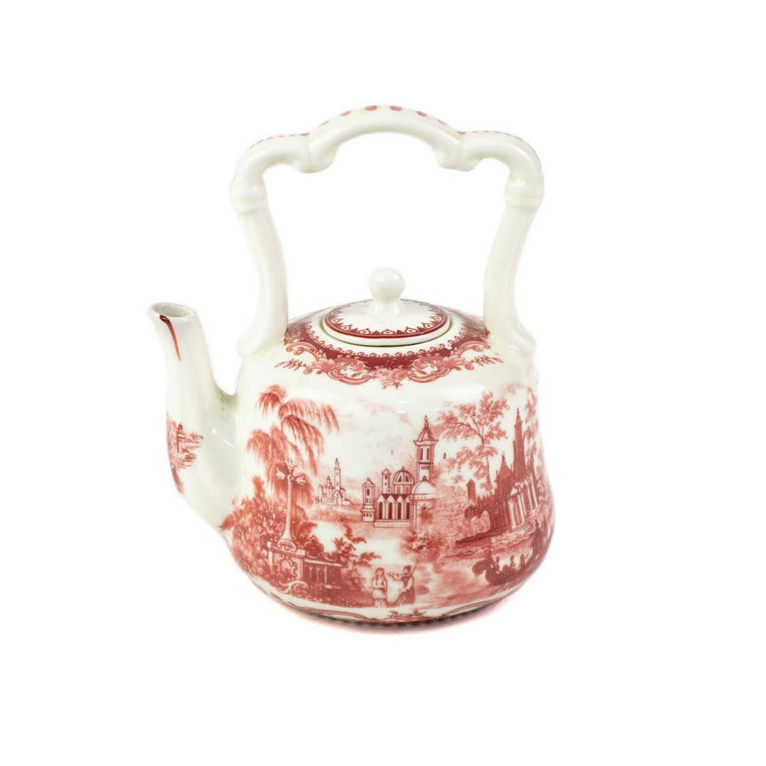 Chinese Red and White Porcelain Miniature Teapot: A vintage Chinese red and white porcelain miniature teapot featuring a scenic transferware design throughout. It is marked on the underside.