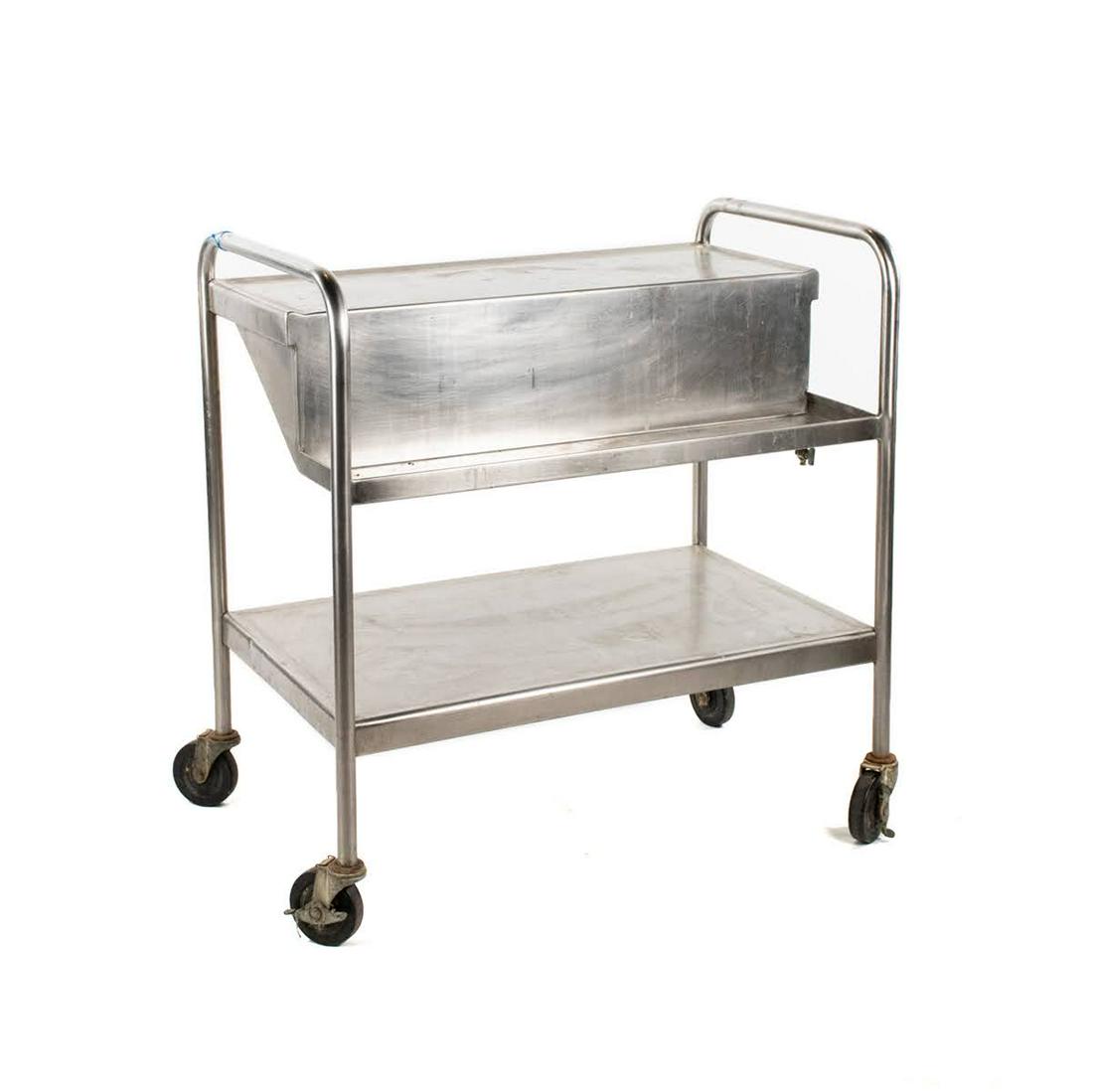 Vintage Stainless Steel Two Tier Laboratory Cart: A vintage stainless steel two tier laboratory cart having top shelf with raised edge and nozzle below. Rests atop four wheels. Unmarked.
