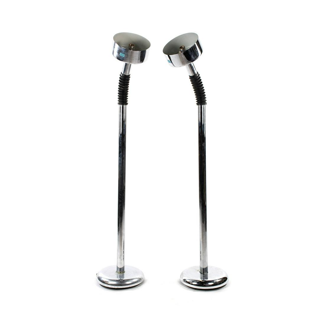 Targetti Sankey MCM Chrome Gooseneck Torchiere Floor: A pair of Targetti Sankey Mid-Century Modern chrome and black rubber gooseneck adjustable torchiere floor lamps having round chrome heads and black gooseneck for adjusting light direction. Resting ato