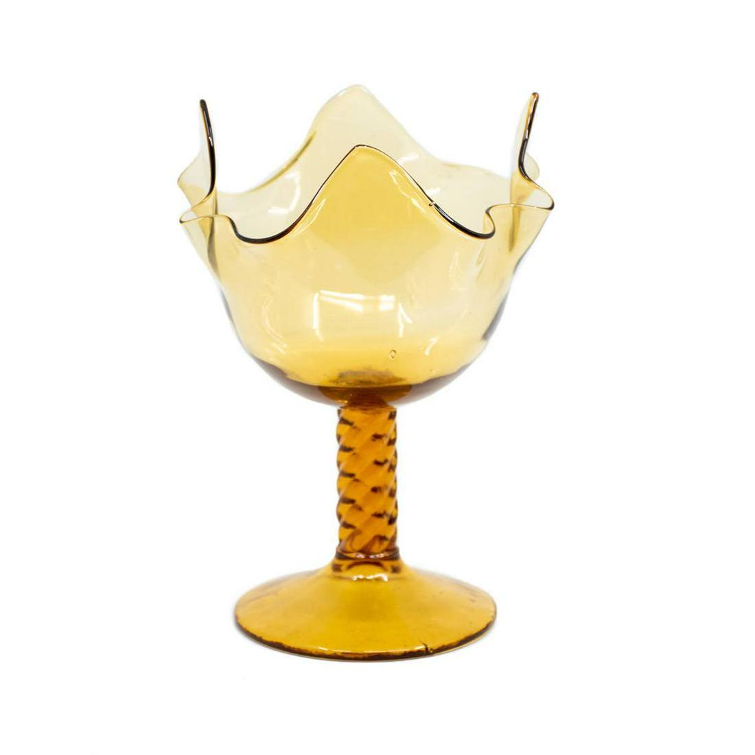 MCM Viking Four Petal Amber Glass Compote: A Mid-Century Modern Viking Glass tall amber compote having four formed petals between ruffled edges. Rests atop a braided stem and round base.