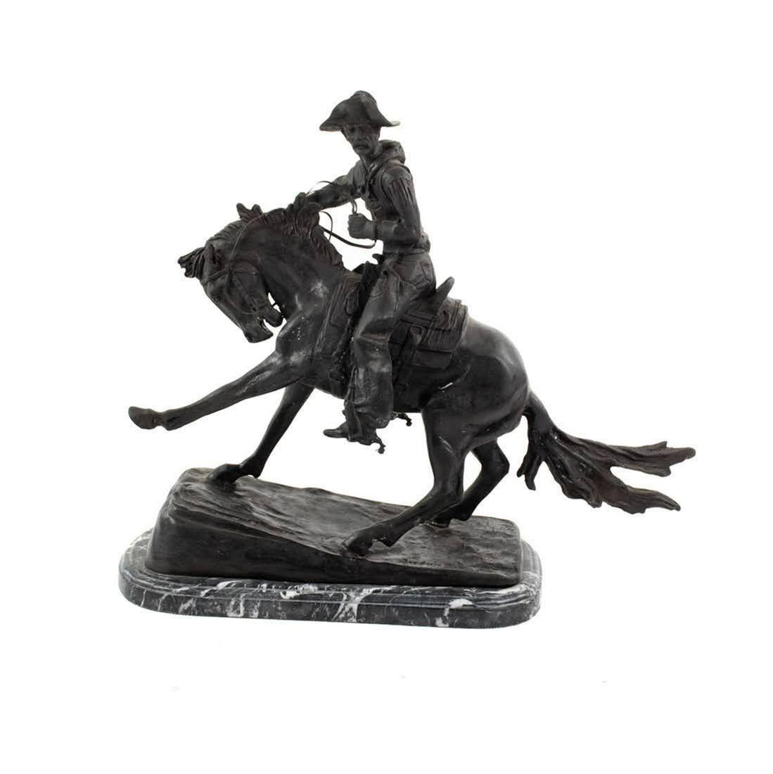 Frederic Remington 'The Cowboy' Cast Sculpture: Frederic Remington (American, 1861-1909) cast bronze 'The Cowboy' sculpture depicting a Western cowboy on horseback. The sculpture is resting atop a green marble base. Signed on the bronze base. Very 