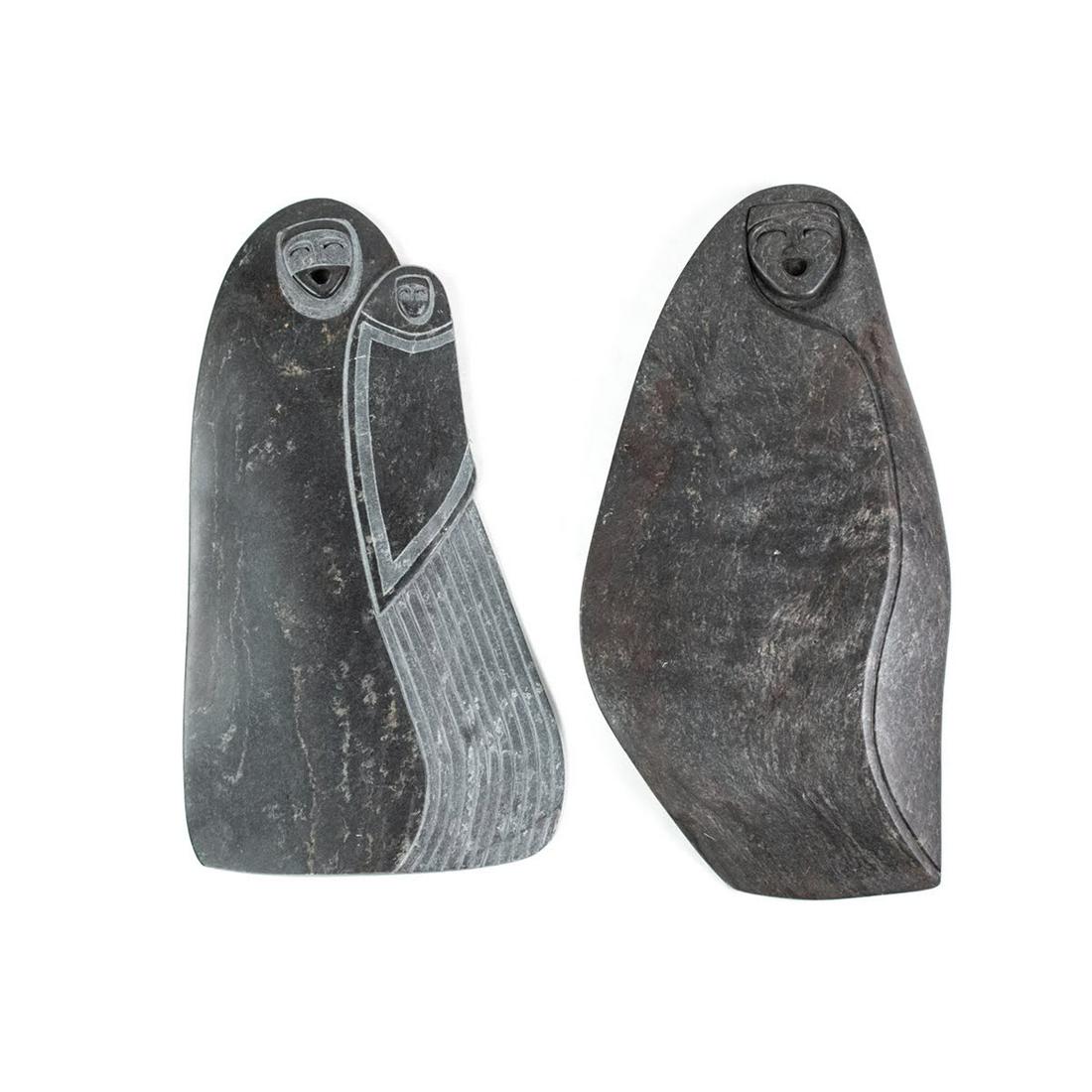 Pair of African Zimbabwe Shona Soap Stone Sculptures: A pair South African, Zimbabwe Shona black soapstone sculptures, one titled 'Grandma's Saddle Bag' depicting two smiling faces and one untitled with just one smiling face. Signed PSHO on back. Dimensi