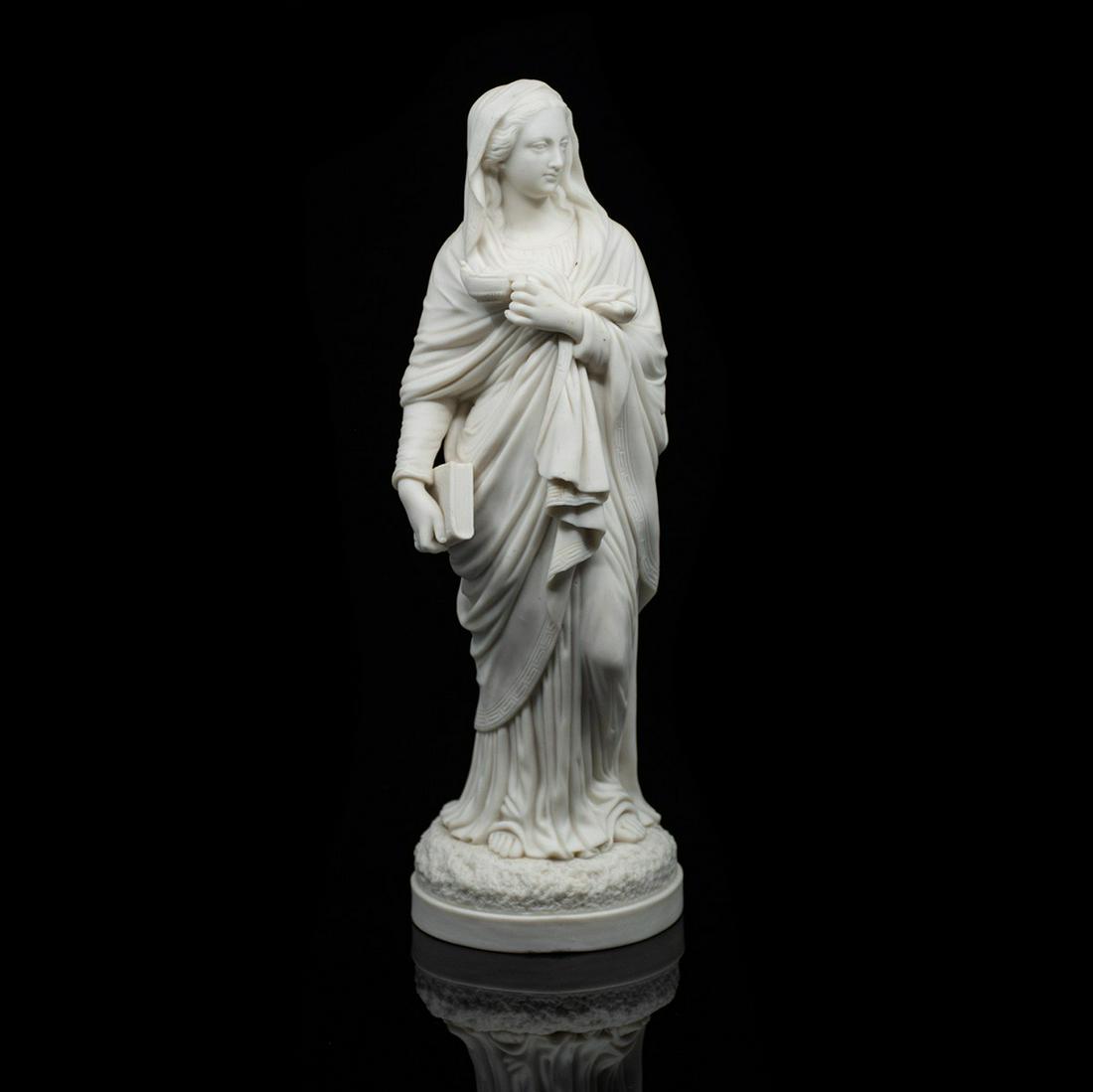 Antique Greco-Roman Parian Statue of Woman: An antique Greco-Roman parian statue of a woman holding a book. It is unmarked.