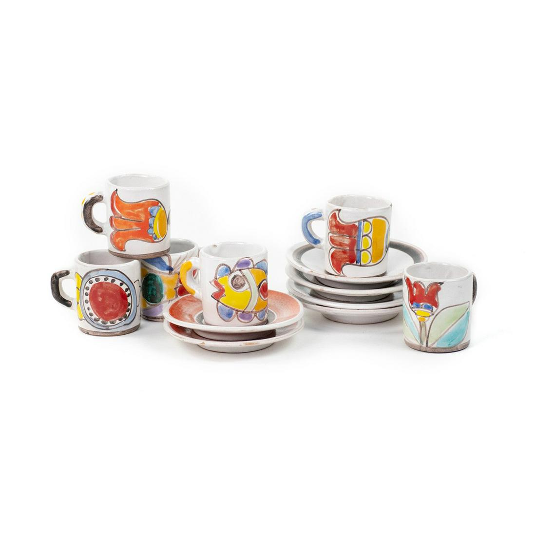 Set of 6 Desimone Italy Ceramic Coffee Mugs and Saucers: A vintage set of 6 Desimone Italy ceramic coffee mugs and saucers having hand painted floral and fish designs on the coffee mugs and orange and brown lined saucers. Marked on undersides 'Desimone Ital
