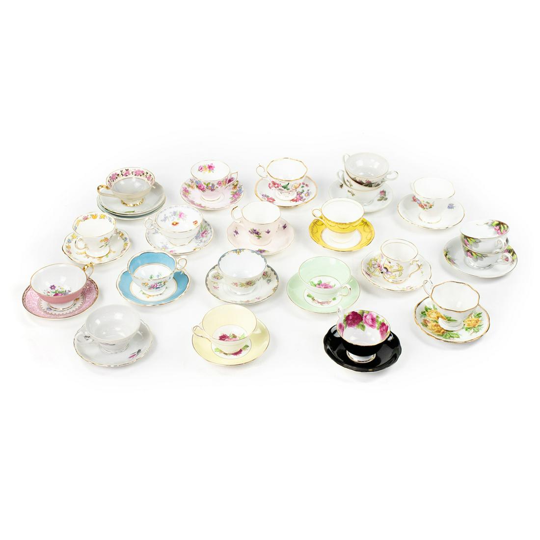 Grouping of 19 Porcelain Tea Cup and Saucer Sets: A grouping of 19 porcelain tea cup and matching saucer sets in various styles, colors, and manufacturers including Rossetti, Jason Bone China, Crown Staffordshire, Royal Bayreuth, Salisbury China, Roy