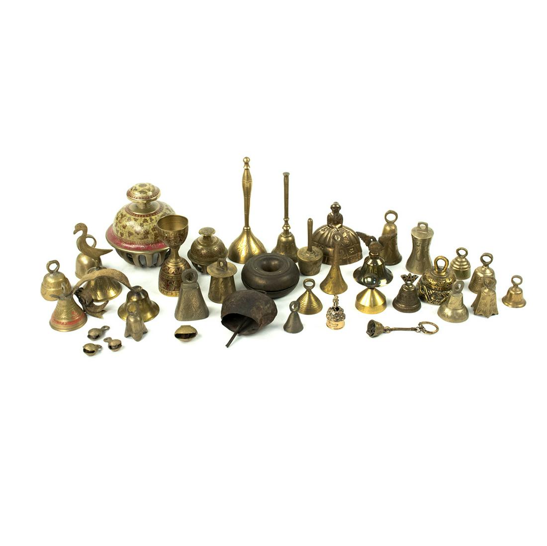 Large Grouping of Late 19th C Brass Metal and Iron: A large grouping of late 19th century brass, metal and iron bells including but not limited to; one bird handle bell, brass handled bells, and small iron finger bells. Some marked.