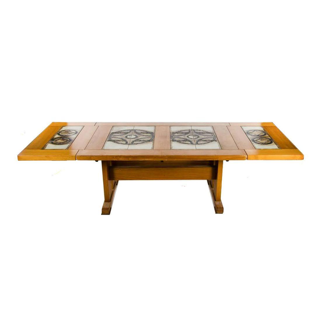 Danish Modern Poul Cadovius Teak Tile Dining Table: A mid-century Danish modern teak dining table by Poul Cadovius having a four-section inlaid tile top. The hand-painted beige tiles are assembled to create black encircled star formations. There is a d