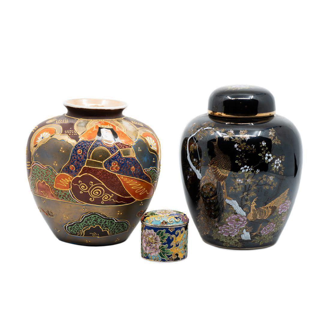 Group 3 Japanese Pottery and Enamelware Vessels: A group of three Japanese pottery and enamelware including a medium bulbous raised enamel Satsuma vase, a hand painted ginger jar with peacock motif, and a small cloisonne snuff jar. Measure 5.5 x 5 x