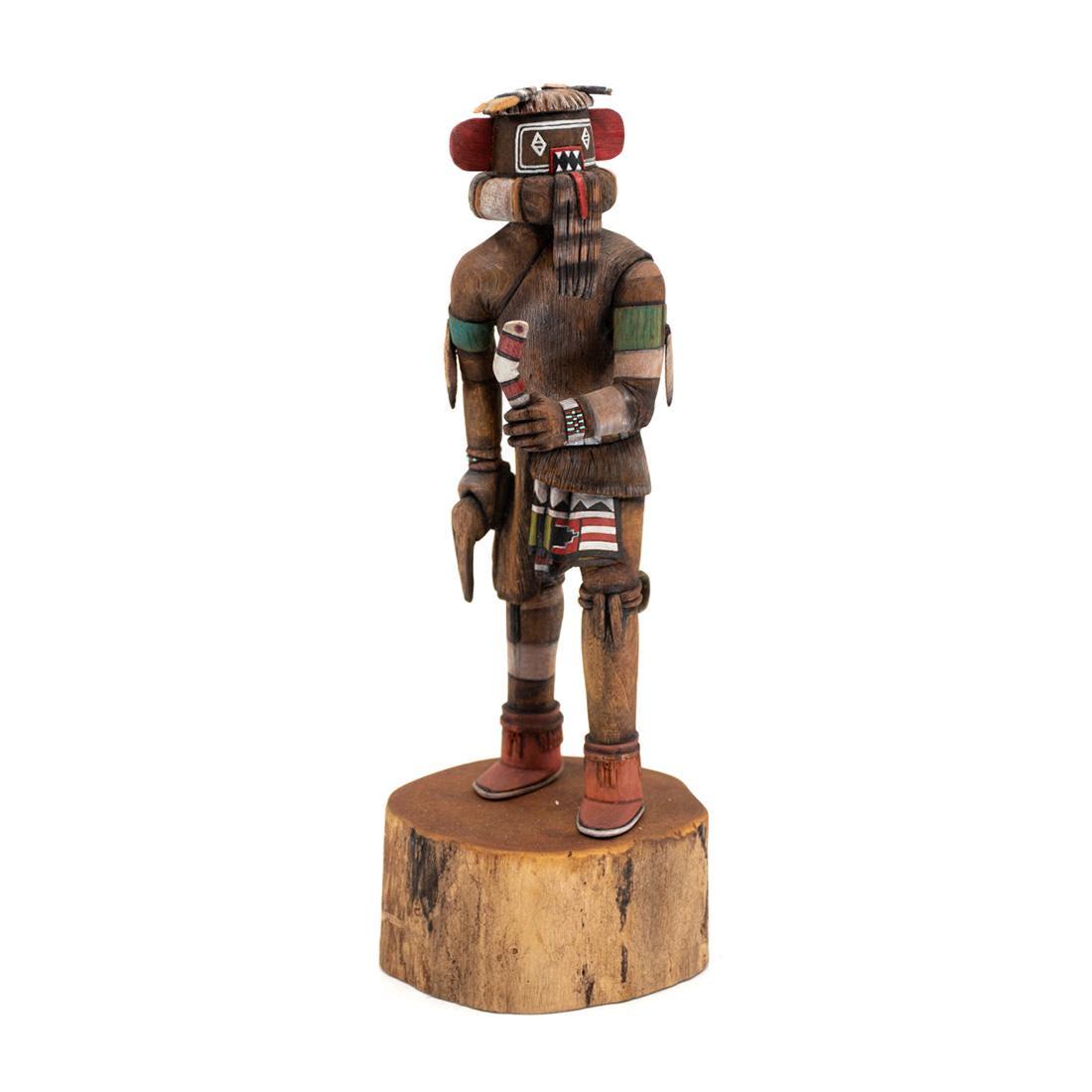 Native American Hopi Left Handed Hunter Katsina Doll: A Native American Hopi Indian carved Left Handed Hunter Katsina (Siyangephoya) doll by Tom Fredericks. The figure features a brown appearance with painted face and turquoise painted turtle on the back