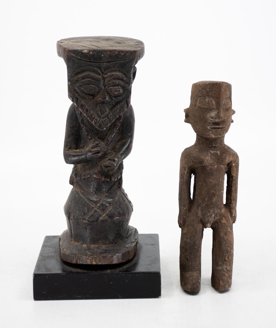 African Nigerian Folk Figures (20th Century): African Nigerian Folk Figures (20th Century), carved wood including one figure ceremonial figure with simple carved features and flat surface and the other depicting a very simple male form figure.