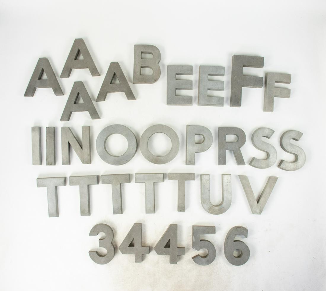 Group of Silver Aluminum Cast Bank Building Letters: Group of silver anodized aluminum cast outside letters removed from bank building from Downtown Mobile, AL. Roughly 6"-8" tall each.