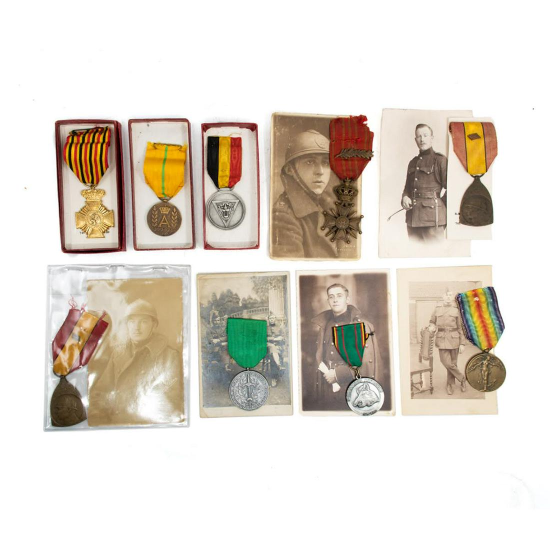 WWI Military Award Medals: A Group of WWI military medals including a Belgian Croix de Guerre with soldier's photograph, a 1914-1918 Commemorative Gold Medal with soldier's photograph, French "March of the Chasseurs Ardennais w