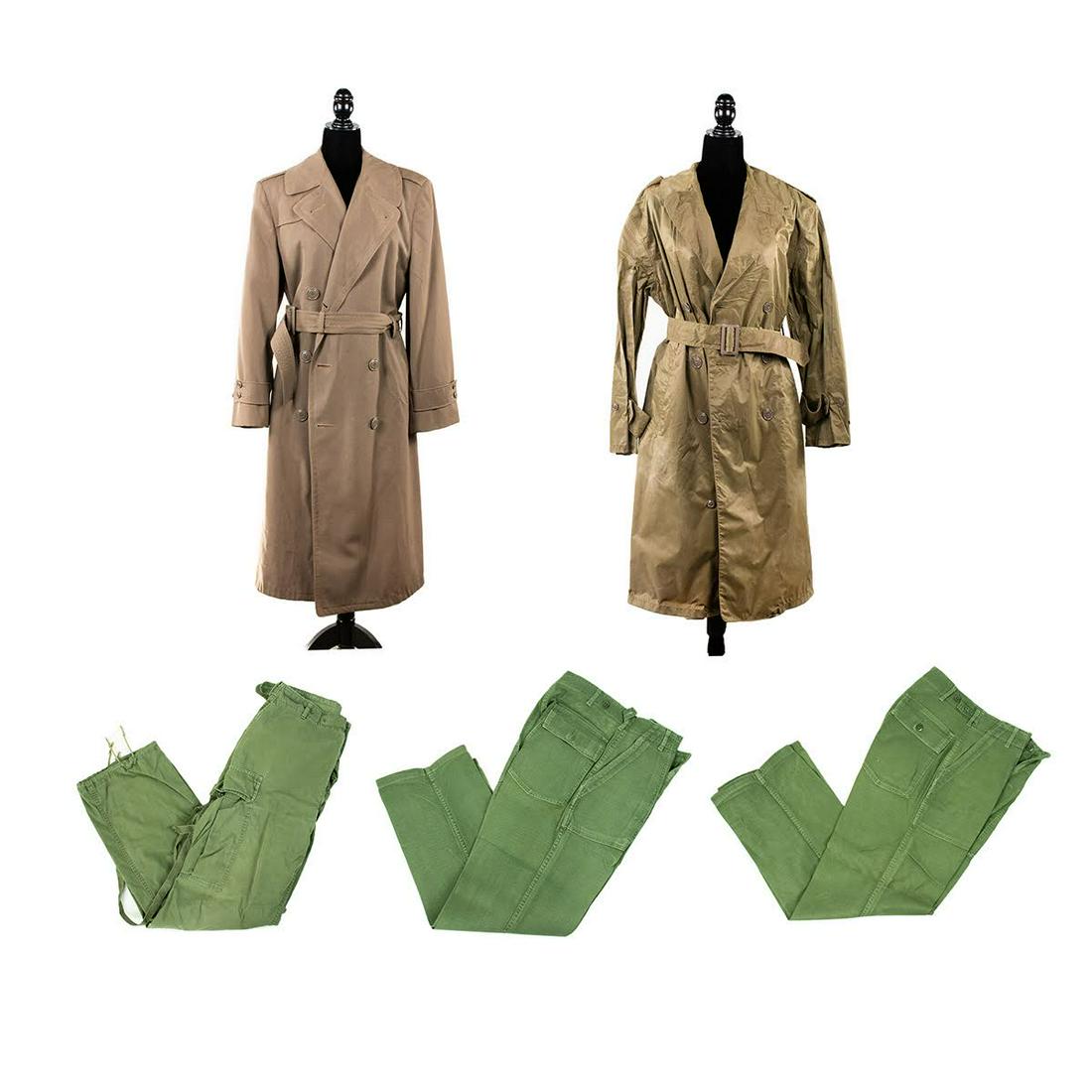 Grouping of US Navy Khaki Trench Coats and Combat Pants: A grouping of US Navy uniform articles including two men's khaki trench coats with waist ties and three green men's combat pants. Marked.