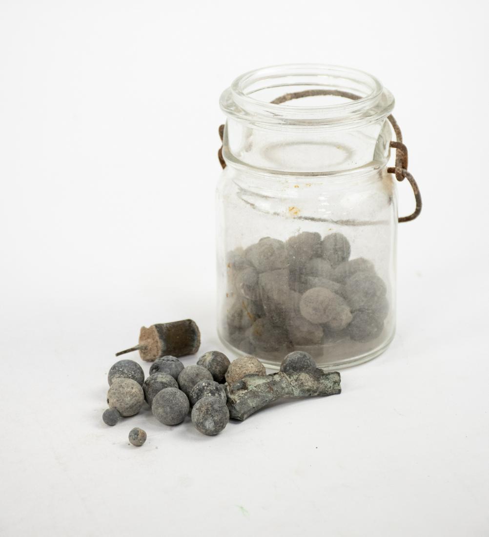 Group of US Civil War Minie Balls and Other Bullets: A group of glass jars of US Civil War minie balls and other bullets. Recovered in the 1990s. Provenance: Larry McCoy - Mobile, AL.