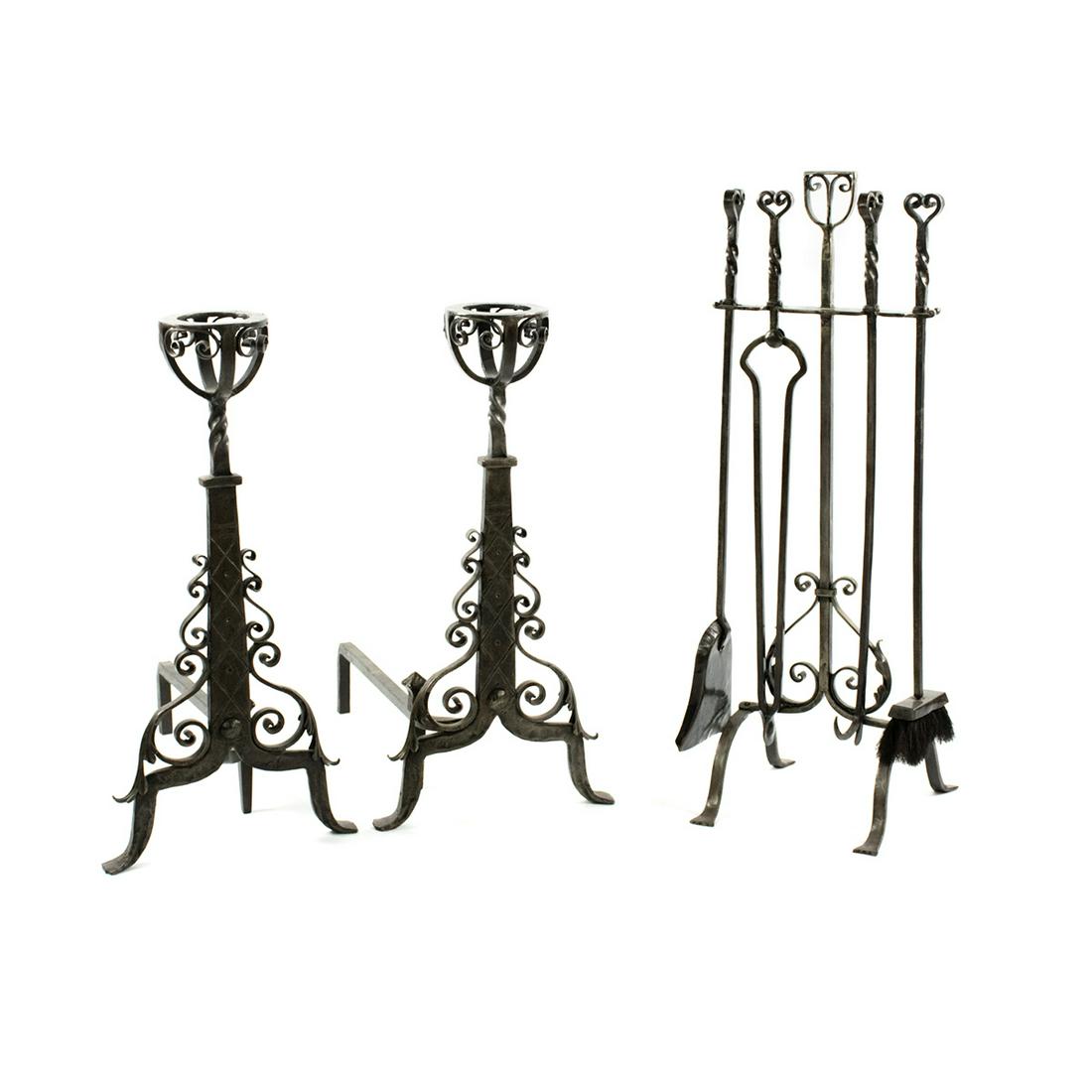 Spanish Arts & Crafts Iron Fire Tool and Andirons Set: A pair of Spanish arts & crafts hand-wrought andirons and a matching fire tool set with its stand. Each piece features ornate spiral detailing. They are unmarked.