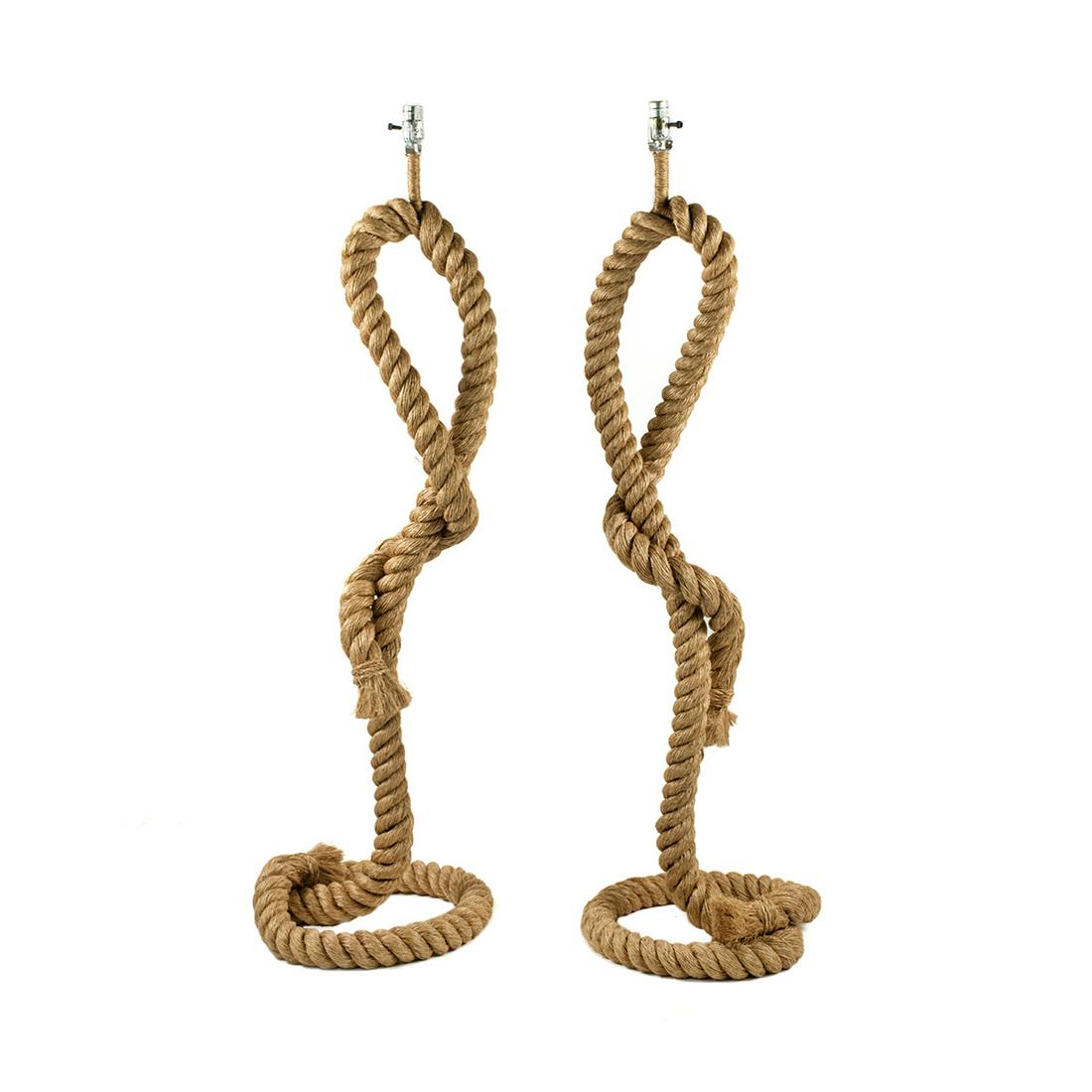 Pair of Modern Rope Knot Floor Lamps: A pair of modern nautical style rope knot floor lamps having curved and twisted rope covered body shaped around metal frame. Unmarked and untested.