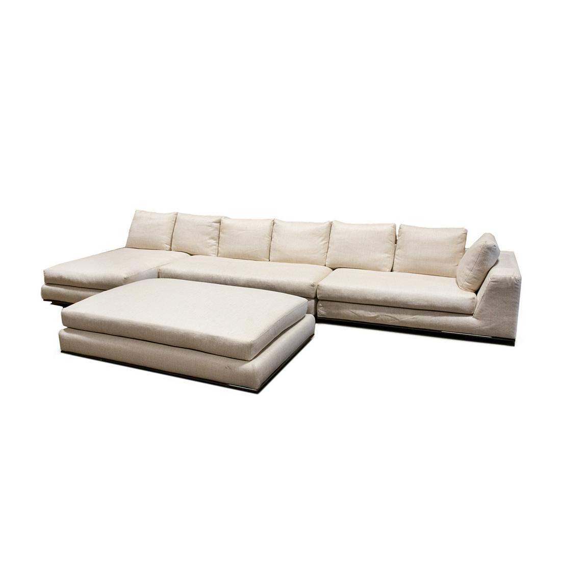 Minotti Italian Cream Sectional Sofa and Ottoman: An Italian designer sectional sofa and ottoman by Minotti. This is a designer floor sample that has never been used. It features cream tweed upholstery, partial goose down filling, and an aluminum bas