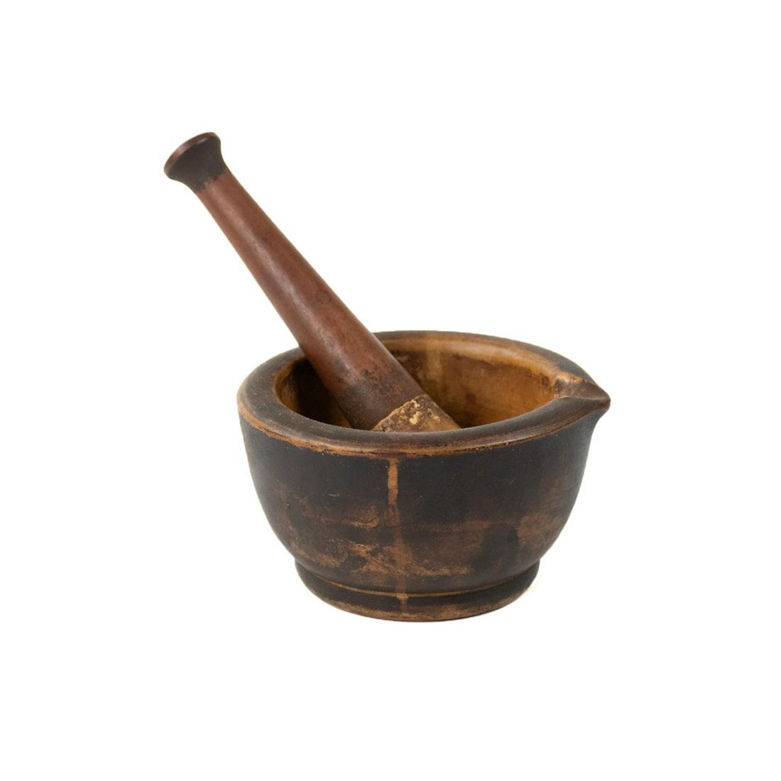 Thomas Maddock's Apothecary Mortar and Pestle Set: An antique apothecary acid proof mortar and pestle set by Thomas Maddock's Sons. This set is constructed of brown stoneware with the pestle having a wooden handle. The mortar is marked "Warranted M.S.