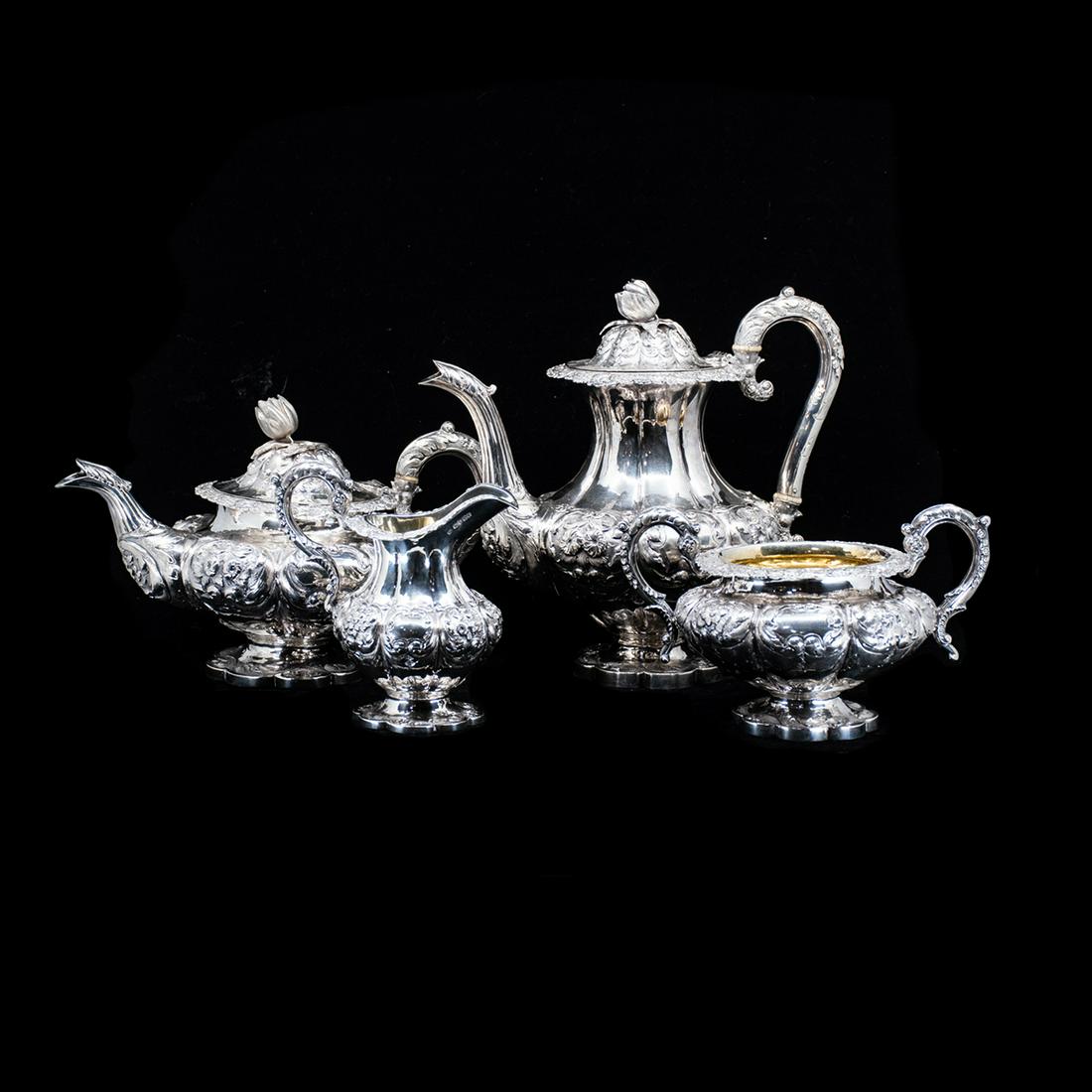1850's Samuel Hayne & Dudley Cater Sterling Tea Service: An antique English sterling silver four-piece beverage tea service by Samuel Hayne & Dudley. This set includes a coffee kettle, tea kettle, pitcher, and handled bowl. Each piece features ornate raised