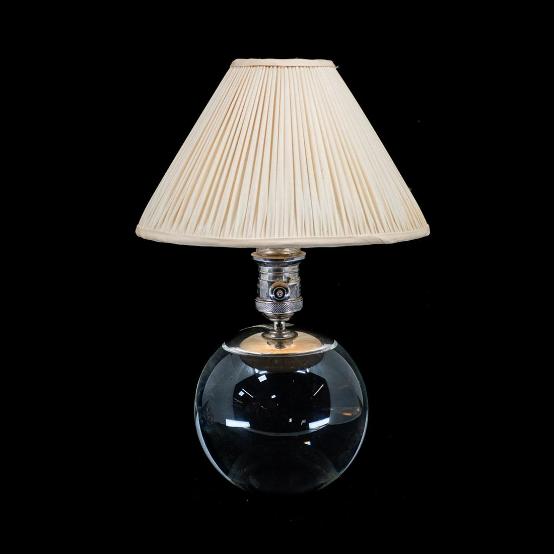 Thomas O'Brien Visual Comfort Co. Crystal Table Lamp: A Thomas O'Brien for Visual Comfort Co. crystal ball form table lamp having silver metal cap and accents. Includes off-white linen shade. Marked on socket.