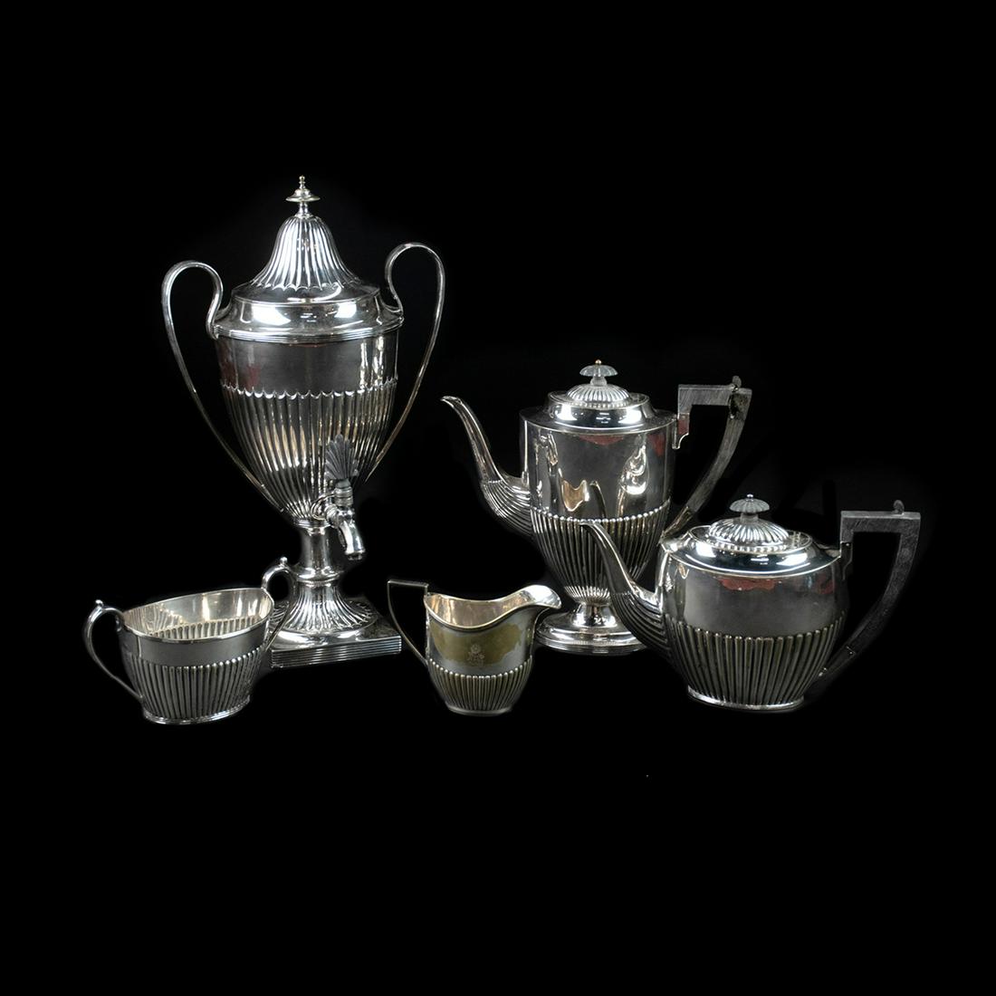 Antique Silver-Plated Tea Service and Samovar: An antique silver-plated tea and coffee service by Mappin & Webb's. This four-piece set includes a coffee pot, teapot, creamer, and sugar dish. Each piece is marked "Triple Deposit Mappin & Webb's Pri