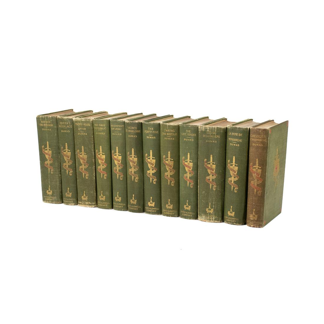 Group of 12 Alexandre Dumas Escutcheon Series Books: A group of 12 Alexandre Dumas Escutcheon Series books including 'Man with Iron Mask', 'Queen's Necklace', 'Twenty Years After', 'The First Republic', 'The Company of Jehu', 'Vicomte de Bragelonne', 'T