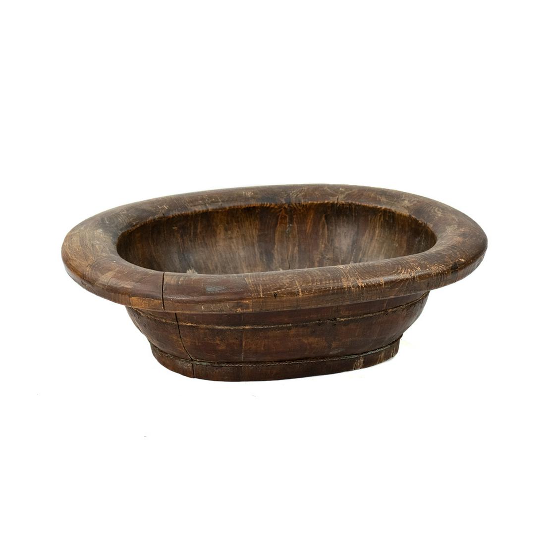 Antique Chinese Primitive Wooden Wash Basin: An antique Chinese primitive wooden wash basin. This piece is constructed of segmented wood bound by braided metal. It is unmarked.