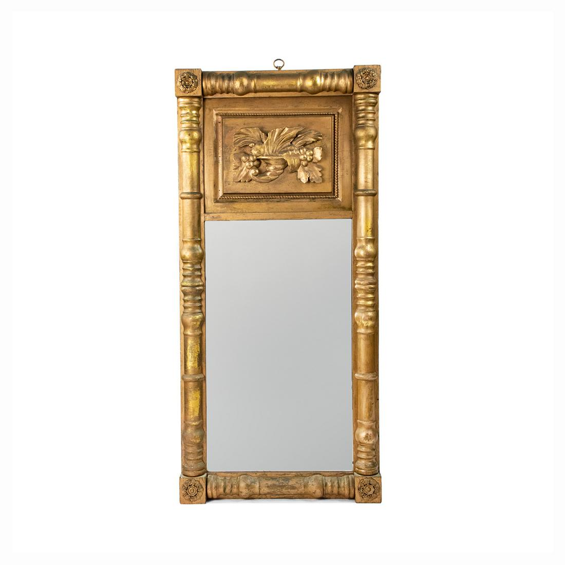 American Empire Gold Gilt Pier Mirror with Cornucopia: An American Empire style gold gilt pier mirror having carved cornucopia motif at the top and rose medallions throughout. Unmarked,.