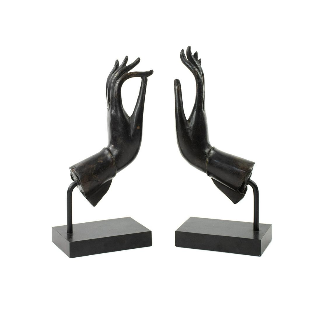 Thai Bronze Buddhist Mudra Hand Sculptures: A pair of vintage Thai bronze Buddhist mudra hand sculptures, each mounted on black composite base. They are unmarked.