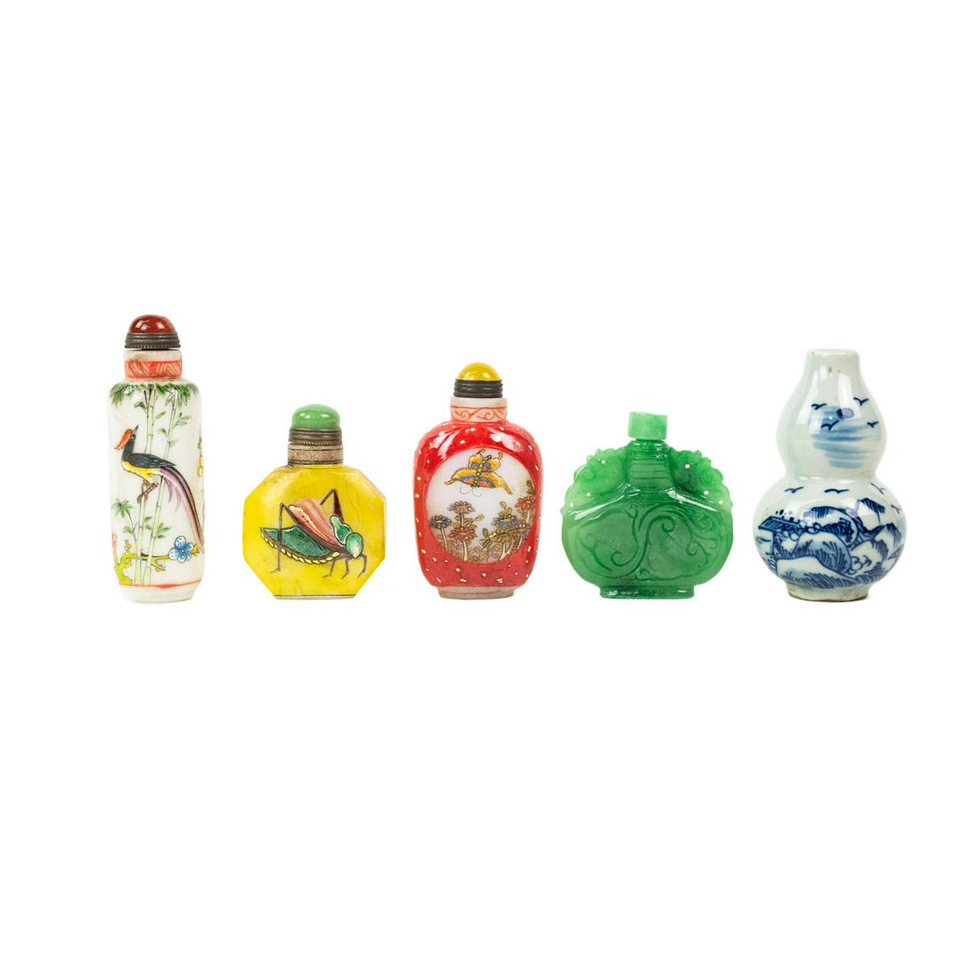 Grouping of Antique Chinese Snuff Bottles: A grouping of five antique Chinese snuff bottles, including a yellow carved opaline glass with painted enamel grasshopper motif bottle with green jade stone stopper marked Qian Long on bottom, a secon