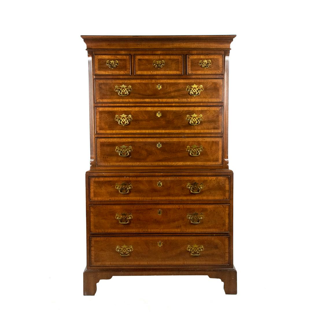 Henredon Georgian Chippendale Style Walnut Dresser: A vintage Henredon Georgian Chippendale style nine drawer walnut tallboy dresser from their 18th Century Portfolio line featuring inlaid band detailing to the drawers, brass hardware, and bracket feet