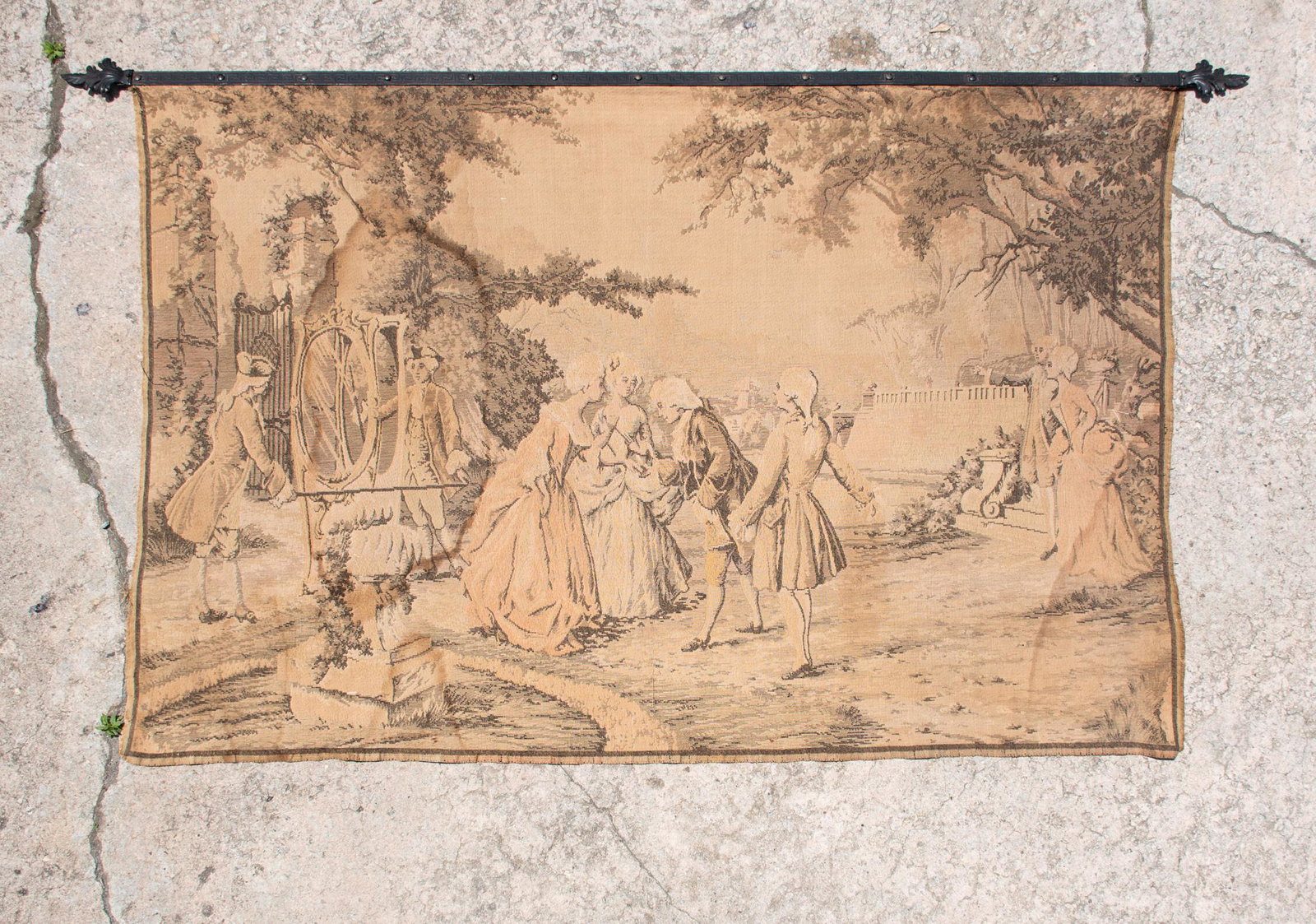 Belgian Louis XIV Style Courting Scene Tapestry: A vintage Belgian made Louis XIV style tapestry featuring a society courting scene in black over a cream base. The tapestry is attached to a black iron rod featuring a repeating Grecian-inspired motif