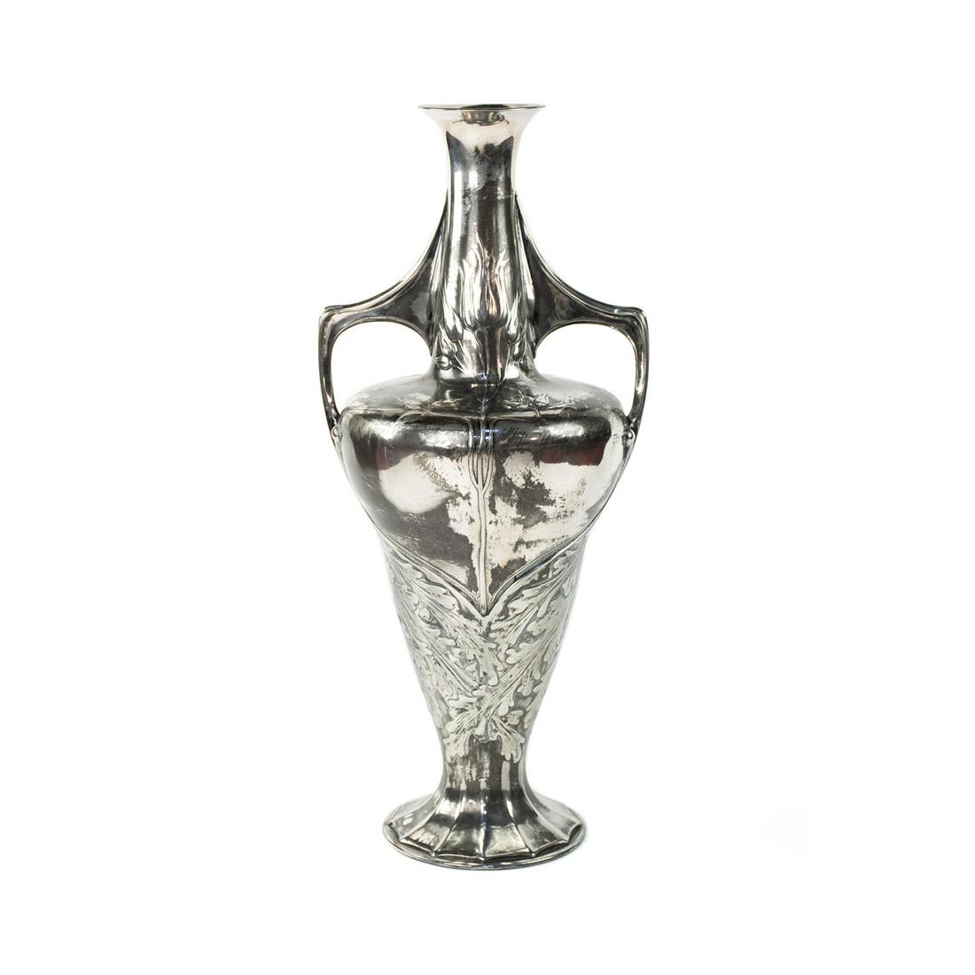Orivit Silverplate Art Nouveau Vase attr Friedrich: An early 20th century silver-plated pewter vase by Orivit of Cologne, Germany attributed to Friedrich Adler. This piece features a stunning Art Nouveau design with an amphora form, prominent twin hand