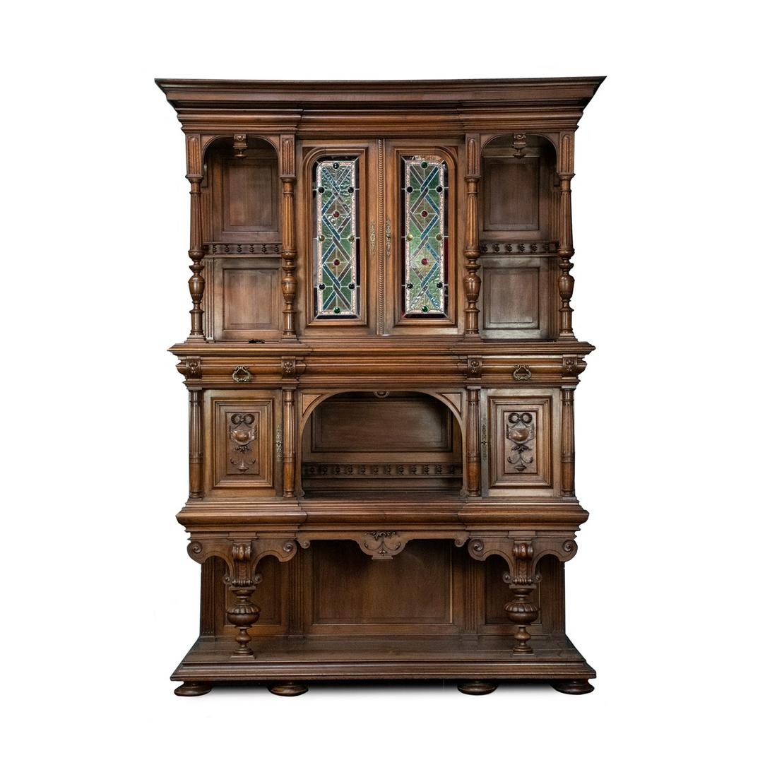 Antique Henry II Monumental Stacked Buffet Cabinet: An antique monumental Belgian Henry II style stacked buffet / bar cabinet with the upper portion featuring a pair of stained glass inset panel cabinet doors at the center flanked by open shelves on bo